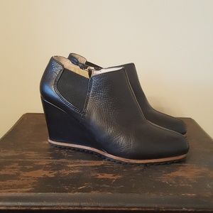 Black wedge ankle booties.